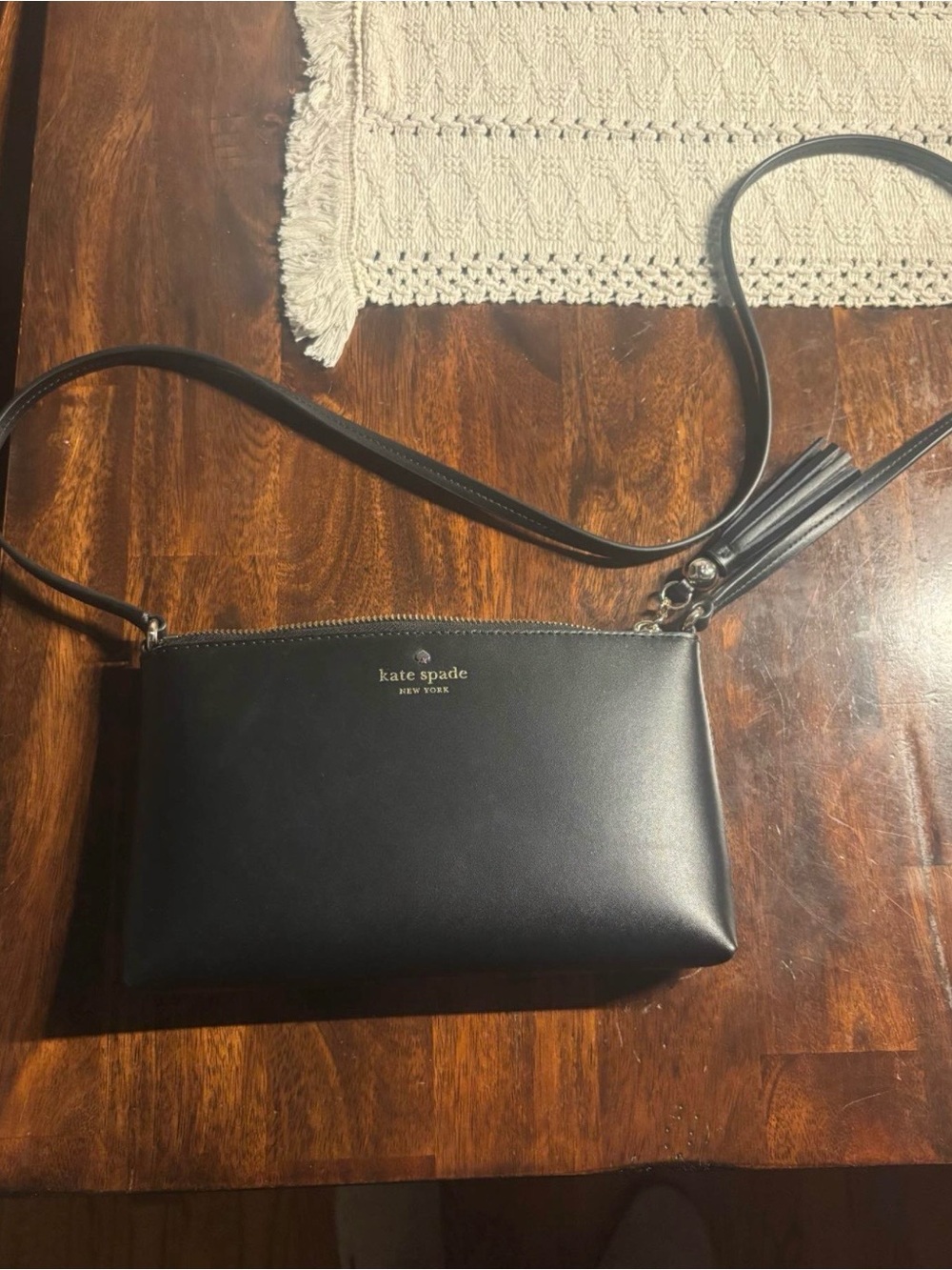 Kate Spade Black Leather Crossbody Bag with Tassel Accent